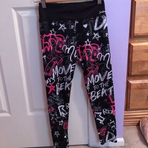 Black leggings with neon pink and white designs